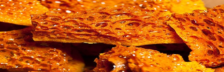 Homemade-Honeycomb-Ice-Cream-A-Sweet-Treat-For-All-Ages-featured-image-200x620w-close-up-of-shards-of-golden-honeycomb-frosted-fusions
