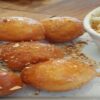 Hot-Meets-Cold-Learn-how-to-Make-Deep-Fried-Ice-Cream-featured-image-200x620w-deep-fried-ice-cream-balls-on-plate-with-dish-of-ice-cream-both-covered-with-sprinkles-frosted-fusions