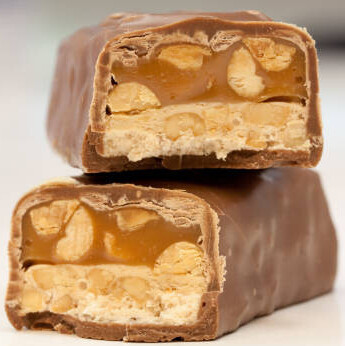 From Marathon To Snickers - A Homemade Recipe For Ice Cream Lovers! image 3 snickers bars sliced to show the inner components frosted fusions