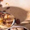 Easy-Homemade-Brown-Butter-Pecan-Ice-Cream-featured-image-207x620w-cropped-bowl-of-brown-butter-pecan-ice-cream-with-caramel-sauce-drizzled-silver-scoop-and-nuts-scattered-frosted-fusions
