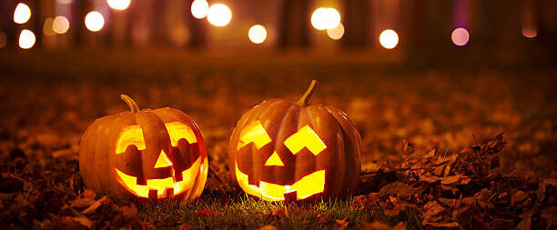 halloween-ice-cream-treats-spooky-ice-scream-recipes-for-the-occasion-image-1-two-carved-pumpkins-with-lights-in-the-background-frosted-fusions