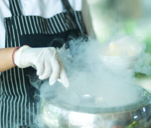 how-to-make-homemade-ice-cream-soft-fluffy-and-scoopable-image-6-liquid-nitrogen-being-used-by-chef-in-apron-to-make-ice-cream-frosted-fusions