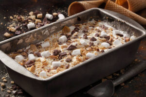 Smores-Homemade-Ice-Cream-Recipe-Ideas-image-8-tray-of-smores-ice-cream-topped-with-mini-marshamallows-chucnk-of-chocolate-and-crushed-biscuits-frosted-fusions