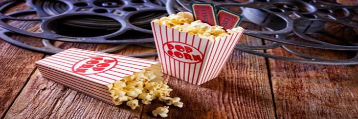 Transform-Movie-Nights-With-Delicious-Homemade-Popcorn-Ice-Cream-featured-image-207x620w-boxes-of-popcorn-with-cinema-tickets-and-movie-reels-frosted-fusions