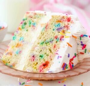 homemade-birthday-cake-ice-cream-recipe-image-4-slice-of-birthday-ice-cream-cake-showing-layers-and-sprinkles-frosted-fusions