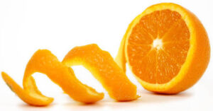 homemade-cranberry-orange-ice-cream-recipe-image-3-a-fresh-orange-sliced-in-half-with-a-spiral-of-peel-white-background-frosted-fusions