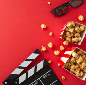 transform-movie-nights-with-delicious-homemade-popcorn-ice-cream-image-6-movie-clip-board-boxes-of-popcorn-and-3d-glasses-red-background-top-view-frosted-fusions