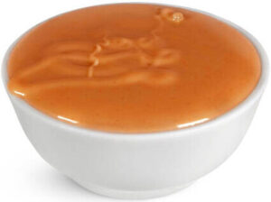 transform-movie-nights-with-delicious-homemade-popcorn-ice-cream-image-9-dish-of-caramel-sauce-frosted-fusions