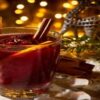 Mulled-Wine-Homemade-Ice-Cream-Recipe-featured-image-207x620w-glasses-filled-with-mulled-wine-with-cinnamon-sticks-cloves-and-orange-slices-with-festive-decor-in-the-background-frosted-fusions