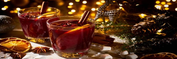 Mulled-Wine-Homemade-Ice-Cream-Recipe-featured-image-207x620w-glasses-filled-with-mulled-wine-with-cinnamon-sticks-cloves-and-orange-slices-with-festive-decor-in-the-background-frosted-fusions