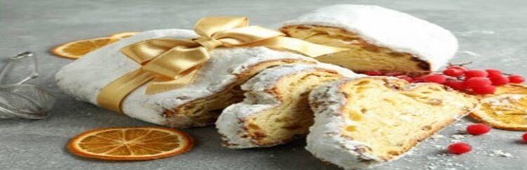 Stollen-Cake-Ice-Cream-Recipe-A-Taste-Of-Germany-featured-image-280x1000w-stollen-cake-sliced-with-festive-decor-frosted-fusions