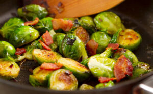 boxing-day-leftovers-turn-christmas-flavours-into-ice-cream-treats-image-4-brussel-sprouts-with-bacon-pieces-being-stirred-through-frosted-fusions