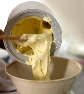 boxing-day-leftovers-turn-christmas-flavours-into-ice-cream-treats-image-6-vanilla-ice-cream-being-poured-from-an-ice-cream-churn-frosted-fusions