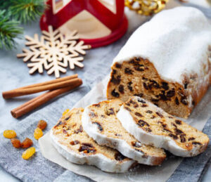 stollen-cake-ice-cream-recipe-a-taste-of-germany-image-2-stollen-cake-mixture-with-raisins-and-mixed-fruits-being-kneaded-frosted-fusions
