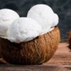 Dairy-Free-Coconut-Based-Frozen-Treats-–-Creamy-Dreamy-100-Delicious-featured-image-207x620w-half-coconut-with-scoops-of-coconut-ice-cream-frosted-fusions