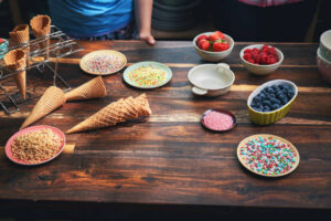 Fun-Easy-And-Healthy-Frozen-Dessert-Recipe-Ideas-For-Kids-image-9-ice-cream-waffle-cones-with-selection-of-sprinkles-and-extra-toppings-frosted-fusions