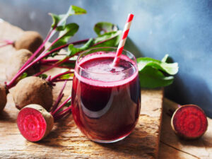 Which-Smoothie-Style-Suits-You-Best-image-11-vibrant-beetroot-smooethi-with-beetroot-tops-to-the-side-frosted-fusions