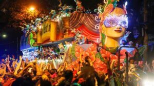 5-Creole-Cajun-Inspired-Ice-Cream-Recipes-To-Jazz-Up-Your-Mardi-Gras-image-2-mardi-gras-parade-showinbg-a-float-with-typical-mardi-gras-colours-Frosted-fusions