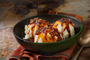 5-Creole-Cajun-Inspired-Ice-Cream-Recipes-To-Jazz-Up-Your-Mardi-Gras-image-4-sweet-heat-honey-ice-cream-with-cayenne-sauce-drizzled-over-the-top-Frosted-fusions