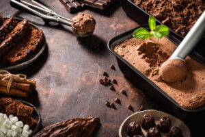 5-Creole-Cajun-Inspired-Ice-Cream-Recipes-To-Jazz-Up-Your-Mardi-Gras-image-7-Spiced-Creole-Chocolate-Ice-Cream-with-spices-scattered-around-Frosted-fusions