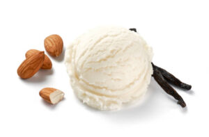 Easy-Homemade-Keto-Ice-Cream-–-A-Delicious-Low-Carb-Recipe-image-5-vanilla-ice-cream-scoop-with-fresh-almonds-and-vanilla-pods-white-background-Frosted-Fusions