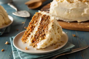 Homemade-Carrot-Cake-Ice-Cream-Recipe-image-6-slice-of-carrot-cake-with-the-frosting-on-display-Frosted-Fusions