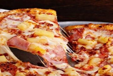National-Pizza-Day-US-Hawaiian-Ham-And-Pineapple-Ice-Cream-featured-image-207x620w-hawaiian-ham-and-pineapple-pizza-sliced-and-being-served-Frosted-Fusions