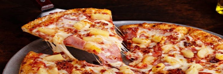 National-Pizza-Day-US-Hawaiian-Ham-And-Pineapple-Ice-Cream-featured-image-207x620w-hawaiian-ham-and-pineapple-pizza-sliced-and-being-served-Frosted-Fusions