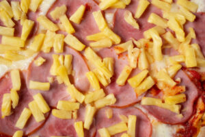 National-Pizza-Day-US-Hawaiian-Ham-And-Pineapple-Ice-Cream-image-2-fresh-ham-and-pineapple-prepared-for-cooking-Frosted-Fusions