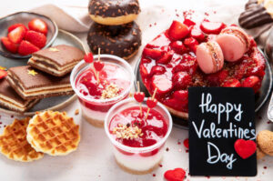 Valentines-Day-Ice-Cream-Dessert-Charcuterie-Board-Ideas-image-2-happy-valentines-sign-with-an-ice-cream-desserts-board-with-heart-shaped-treats-Frosted-Fusions