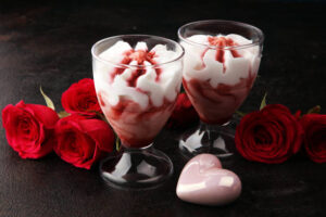 Valentines-Day-Ice-Cream-Dessert-Charcuterie-Board-Ideas-image-4-twi-ice-cream-parfaits-in-glasses-with-red-roses-Frosted-Fusions