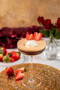 Valentines-Day-Ice-Cream-Dessert-Charcuterie-Board-Ideas-image-6-affogato-ice-cream-in-tall-glass-with-red-roses-in-the-background-Frosted-Fusions