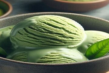 Homemade Matcha Ice Cream Recipe – A Taste Of Japan featured image 637x1920w bowl of matcha ice cream with matcha powder in bowls in background and green tea leaves Forsted Fusions