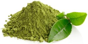 Homemade-Matcha-Ice-Cream-Recipe-–-A-Taste-Of-Japan-image-2-pile-of-matcha-pwder-next-to-tea-leaves-white-background-Frosted-Fusions