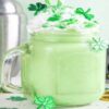 Mint-To-Be-Shamrock-Shake-Ice-Cream-Recipes-For-St.-Patricks-Day-featured-image-207x620w-shamrock-shake-in-glass-with-shamrocks-gold-coins-and-traditional-Irish-Green-hat-Frosted-Fusions