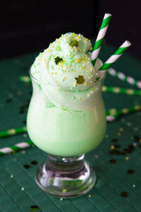 Mint-To-Be-Shamrock-Shake-Ice-Cream-Recipes-For-St.-Patricks-Day-image-6-shamrock-shake-in-glass-with-straws-and-shamrock-Frosted-Fusions