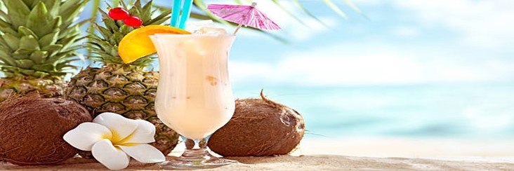 Piña Colada Sorbet & Ice Cream – The Best Of Both Worlds Featured image 207x620w pina colada in tall glass with umbrellas with beach setting in the background Frosted Fusions