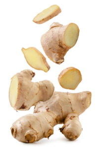 Rhubarb-Ginger-Sorbet-Recipe-–-Light-Spiced-Refreshing-image-6 root ginger sliced into pieces white background Frosted-Fusions