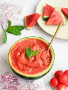 Watermelon-Sorbet-Granita-–-A-Refreshing-Taste-Of-Spring-image-2-watermelon-sorbet-serve-in-watermelon-shell-with-fresh-watermelon-top-view-Frosted-Fusions
