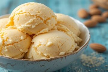 Honey, Yoghurt & Toasted Almond Ice Cream – A Naturally Sweet Scoop featured image 637x1920w bowl of honmey ice cream with a glass jar of honey dish of yoghurt and fresh almonds to the side Frosted Fusions