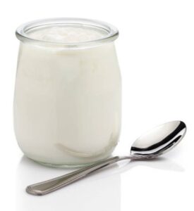 Honey, Yoghurt & Toasted Almond Ice Cream – A Naturally Sweet Scoop image 3 glass jar of yoghurt with silver spoon white background Frosted Fusions