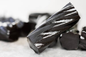 National-Liquorice-Day-–-Meets-A-Bold-Homemade-Ice-Cream-image-7-close-up-of-thick-black-glossy-liquorice-sticks-Frosted-Fusions