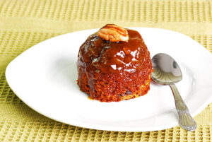 Sticky Toffee Pudding Ice Cream – A Delicious Fusion Of Flavours image 6 sticky toffee pudding on white plate Frosted Fusions