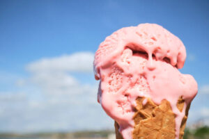 Summertime, And The Ice Cream Is Easy – It’s Ice Cream Time Image 3 slightly melting ice cream in waffle cone with sunny blus sky background Frosted Fusions