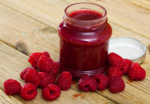 The Easter Ice Cream Egg Illusion A Fun Unexpected Easter Treat Image 10 jar of raspberry jam with fresh raspberries Frosted Fusions