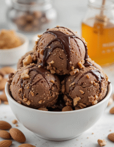 Tribute To Dark Chocolate Toblerone – Make Your Own Homemade Ice Cream Version image 6 bowl of dark chocolate ice cream with fresh almonds and honey Frosted Fusions
