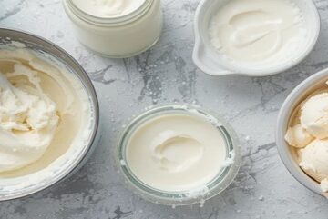 Troubleshooting-Tips-And-Tricks-For-No-Churn-Ice-Cream-featured-image-637x1920w-top-view-showing-basic-no-churn-ice-cream-equipment-and-bowl-of-soft-no-churn-ice-cream-Frosted-Fusions