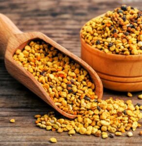 Bee-Happy-–-A-Celebration-Of-Bees-Honey-Ice-Cream-Image-1-bee-pollen-crumbs-in-scoop-and-jar-Frosted-Fusions