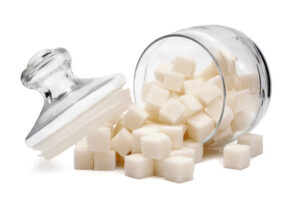 Learn-How-To-Make-Ice-Cream-Without-Added-Sugar-image-1-jar-of-sugar-cubes-spilled-Frosted-Fusions