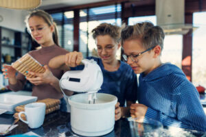 Summer Holidays Day 2 Mum, I’m Bored! Fun Ice Cream Ideas For Kids image 10 three children in kitchen with ingredients and hand mixer Frosted Fusions